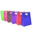 Tradineur - Pack de 12 bolsas de pvc para regalo, incluyen lazo de lunares decorativo, 26 x 19,3 cm, colores surtidos